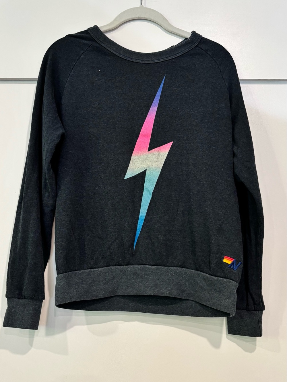 Aviator Nation Black Sweatshirt with Pink-to-Blue Gradient Lightning Bolt